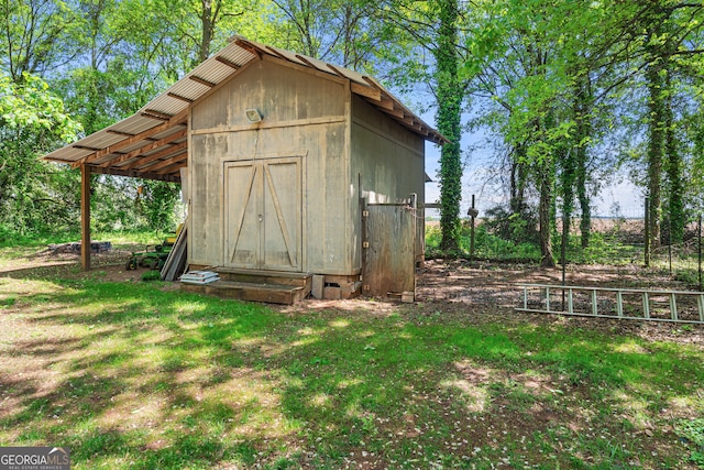 view of shed with fence