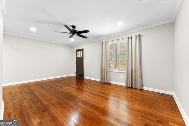 empty room with ceiling fan, recessed lighting, wood finished floors, and visible vents