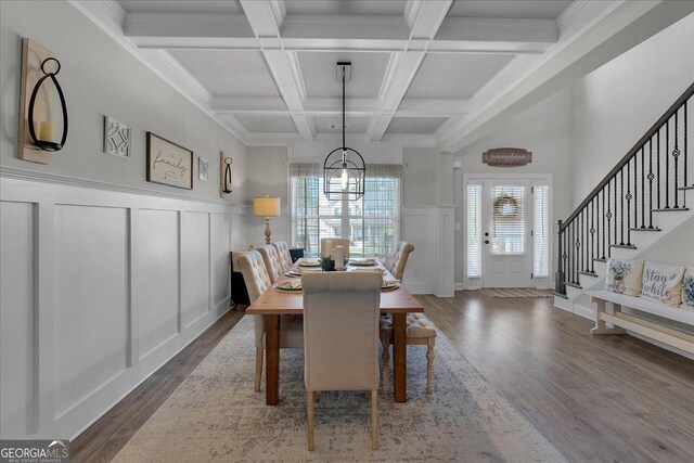 4575 Birch Way, Loganville, GA 30052 - dining area with a decorative wall, wood finished floors, beam ceiling, a chandelier, and stairs