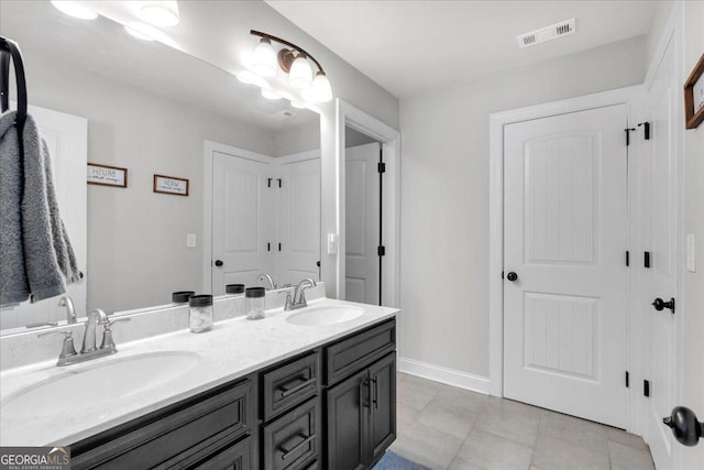 4575 Birch Way, Loganville, GA 30052 - bathroom with double vanity and baseboards