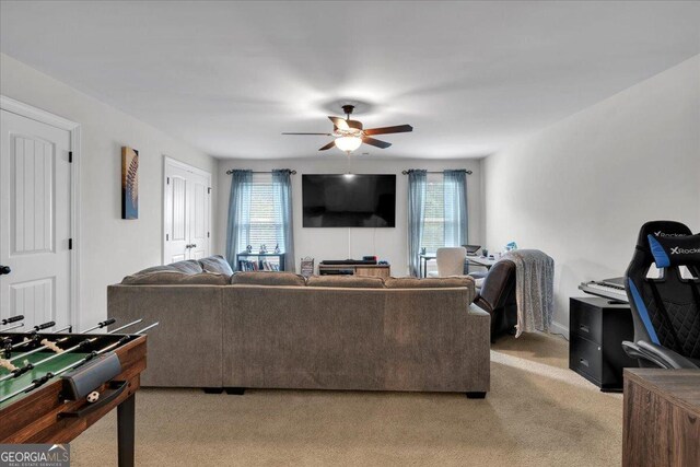 4575 Birch Way, Loganville, GA 30052 - living area featuring light carpet and a ceiling fan