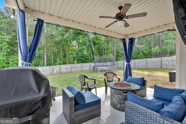 4575 Birch Way, Loganville, GA 30052 - view of patio / terrace featuring a trampoline, an outdoor living space with a fire pit, ceiling fan, and grilling area