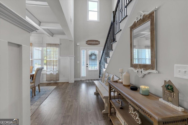 4575 Birch Way, Loganville, GA 30052 - entryway featuring wood finished floors, beamed ceiling, stairs, and a high ceiling