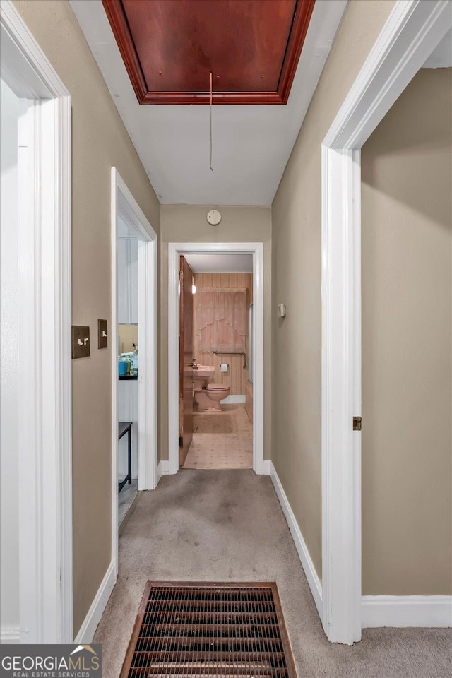 829 Berkshire Dr, Washington, GA 30673 - hall with baseboards, attic access, and carpet flooring