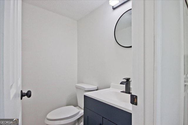 4701 Flat Shoals Rd Unit 35E, Union City, GA 30291 - bathroom with vanity and a textured ceiling