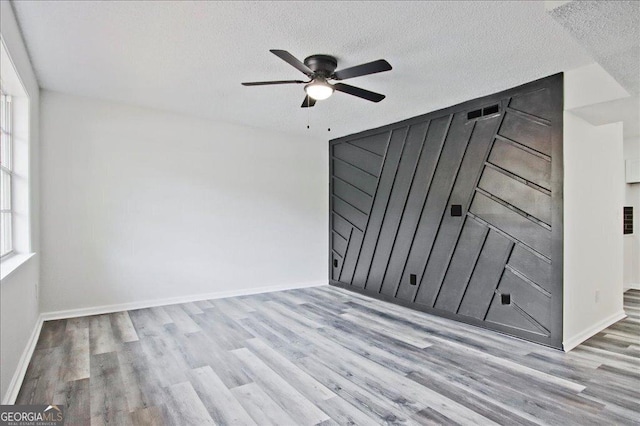 4701 Flat Shoals Rd Unit 35E, Union City, GA 30291 - spare room featuring wood finished floors, a ceiling fan, and a textured ceiling