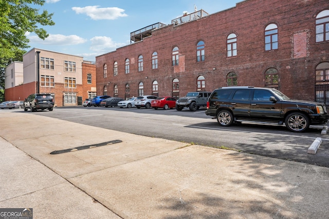 view of property with uncovered parking