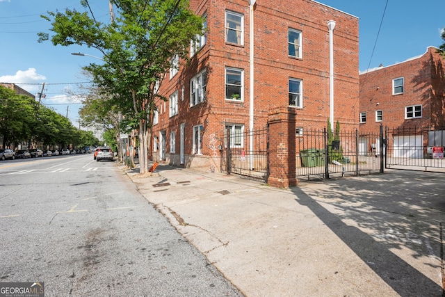 view of property with fence