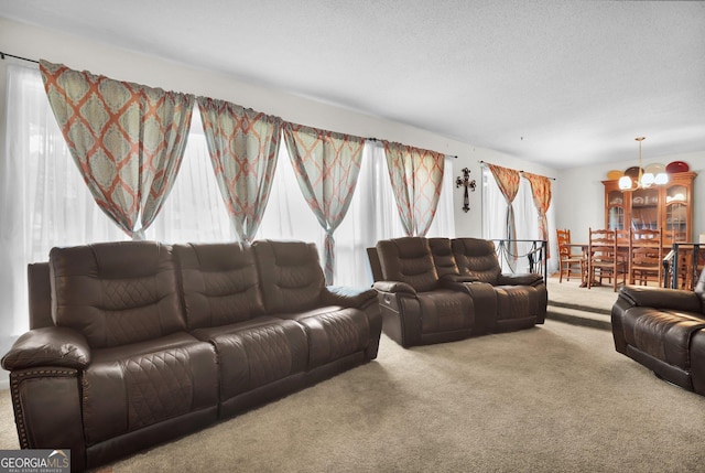 25 Golf Club Cir, Statesboro, GA 30458 - living room featuring an inviting chandelier, a textured ceiling, and carpet flooring