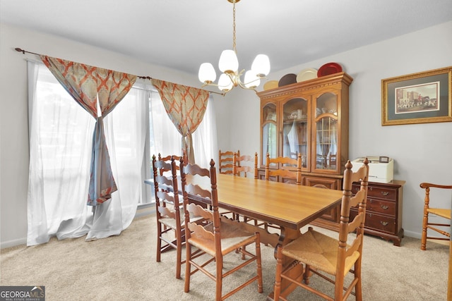 25 Golf Club Cir, Statesboro, GA 30458 - dining space featuring light colored carpet, a chandelier, and baseboards