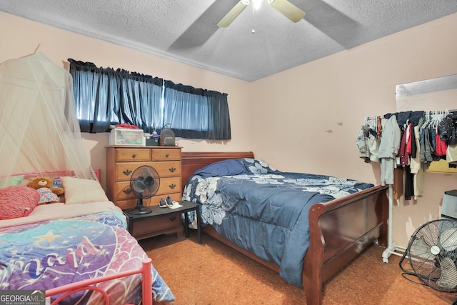 25 Golf Club Cir, Statesboro, GA 30458 - bedroom with carpet flooring, a textured ceiling, a spacious closet, and a closet
