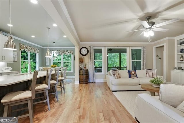 4383 Capstone Ct NE, Roswell, GA 30075 - living area featuring light wood finished floors, ceiling fan, ornamental molding, and recessed lighting