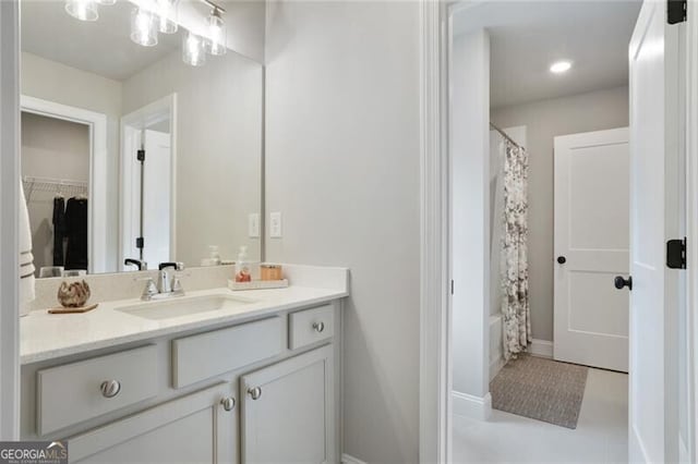 4383 Capstone Ct NE, Roswell, GA 30075 - bathroom with vanity, shower / tub combo, and a walk in closet