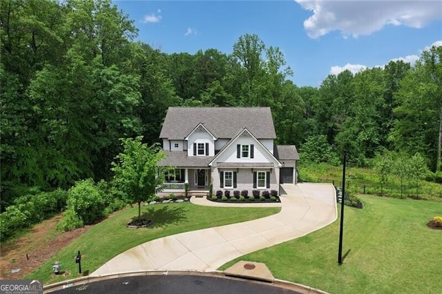 4383 Capstone Ct NE, Roswell, GA 30075 - view of front of home with driveway, a wooded view, a garage, and a front lawn