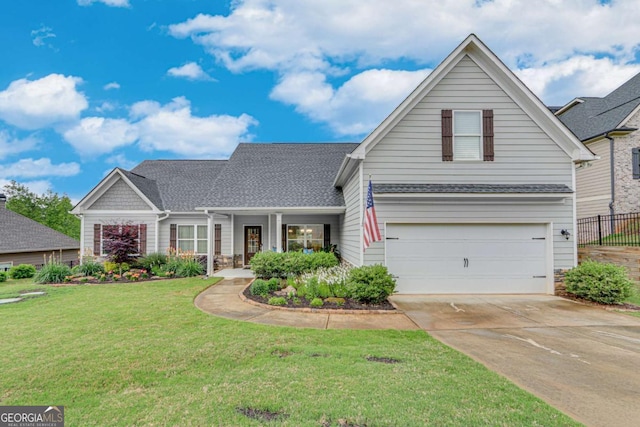 traditional-style house featuring driveway, fence, an attached garage, stone siding, and a front lawn