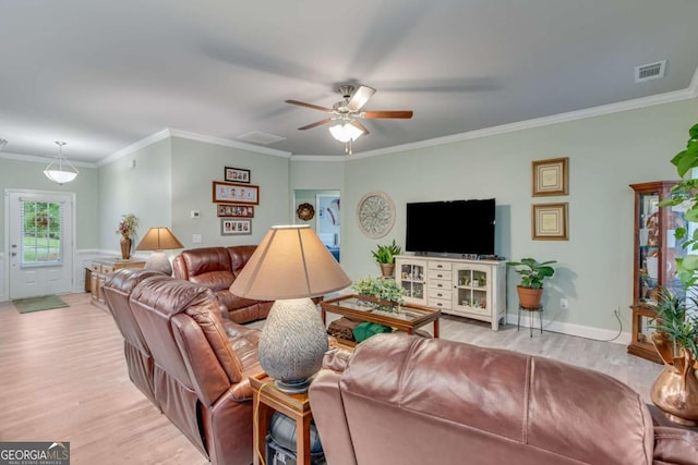 living area with ceiling fan, crown molding, visible vents, and light wood-style floors