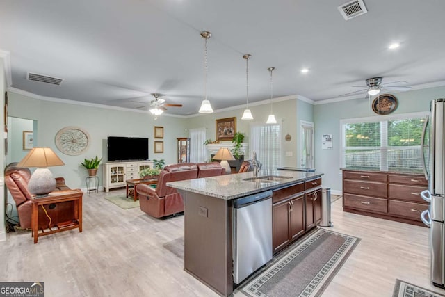 kitchen with a sink, ceiling fan, visible vents, and appliances with stainless steel finishes