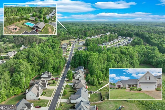 bird's eye view with a wooded view and a residential view