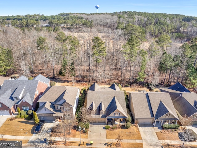 1141 Pebble Creek Ln, Locust Grove, GA 30248 - aerial perspective of suburban area featuring a forest