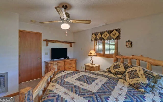 carpeted bedroom with visible vents and ceiling fan