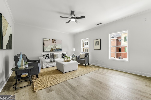 3460 Lockmed Dr, Peachtree Corners, GA 30092 - living room featuring crown molding, wood finished floors, and ceiling fan