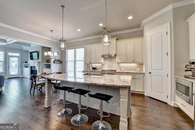 919 Olmsted Ln, Johns Creek, GA 30097 - kitchen with decorative backsplash, dark wood finished floors, recessed lighting, and stainless steel microwave
