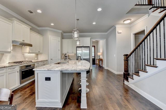919 Olmsted Ln, Johns Creek, GA 30097 - kitchen featuring a sink, under cabinet range hood, white cabinets, and appliances with stainless steel finishes