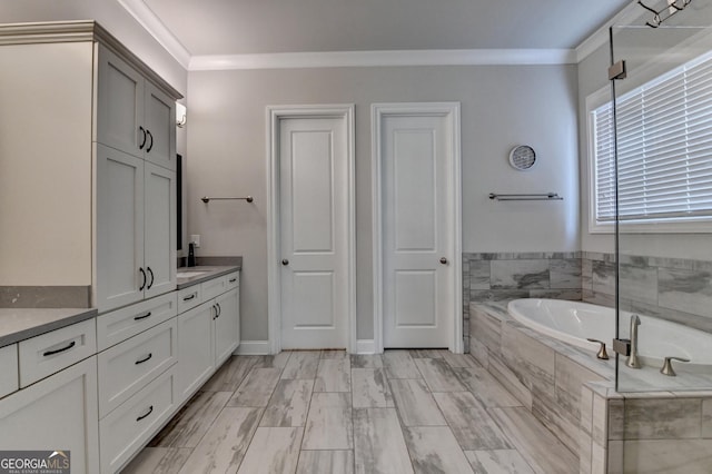919 Olmsted Ln, Johns Creek, GA 30097 - bathroom with vanity, ornamental molding, and a garden tub