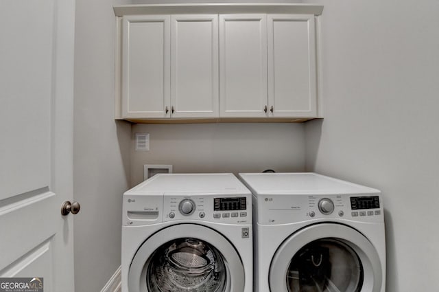 919 Olmsted Ln, Johns Creek, GA 30097 - washroom with cabinet space and independent washer and dryer