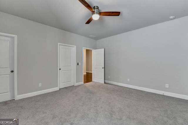 919 Olmsted Ln, Johns Creek, GA 30097 - unfurnished bedroom featuring baseboards, ceiling fan, and carpet