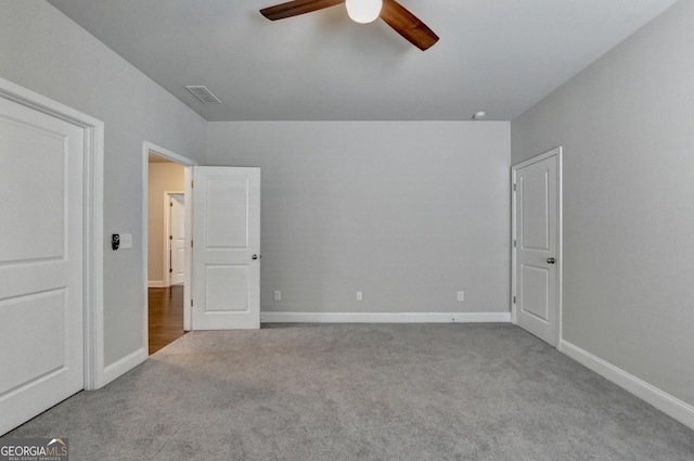 919 Olmsted Ln, Johns Creek, GA 30097 - unfurnished bedroom featuring carpet, visible vents, baseboards, and a ceiling fan