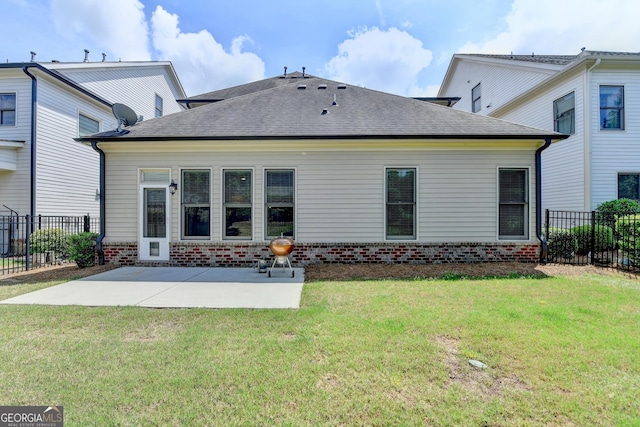 919 Olmsted Ln, Johns Creek, GA 30097 - rear view of house featuring fence, brick siding, a yard, a patio, and a shingled roof