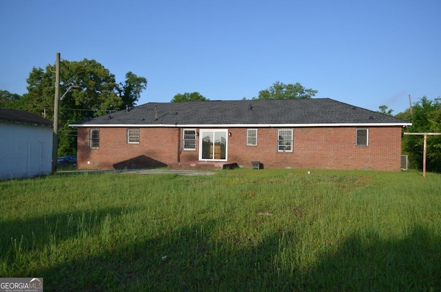 rear view of house featuring brick siding