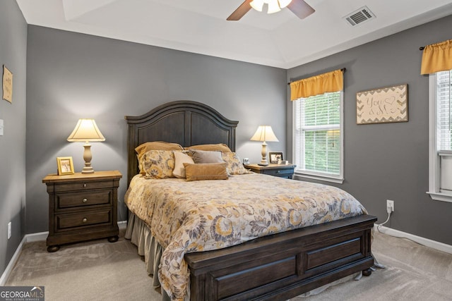 bedroom with a ceiling fan, light carpet, baseboards, and visible vents