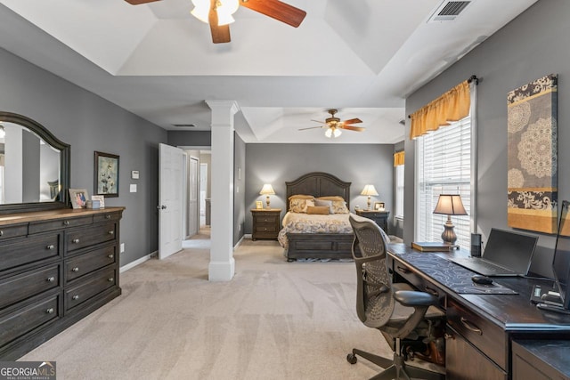 bedroom featuring ornate columns, visible vents, baseboards, a raised ceiling, and light colored carpet
