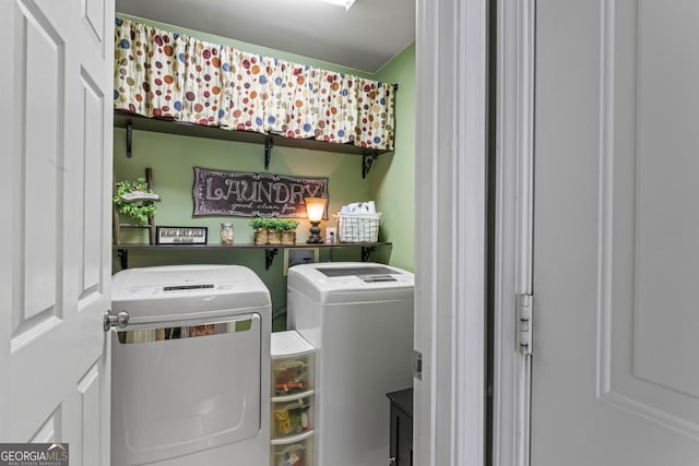 washroom featuring laundry area and separate washer and dryer