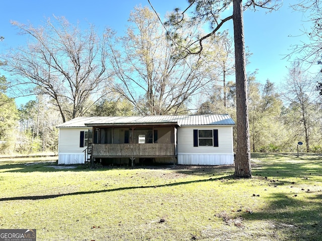 104 Scattered Pines Rd, Hortense, GA 31543 - manufactured / mobile home featuring a sunroom, metal roof, and a front yard