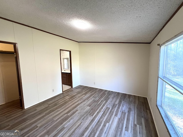104 Scattered Pines Rd, Hortense, GA 31543 - unfurnished bedroom with wood finished floors, a textured ceiling, crown molding, and a decorative wall
