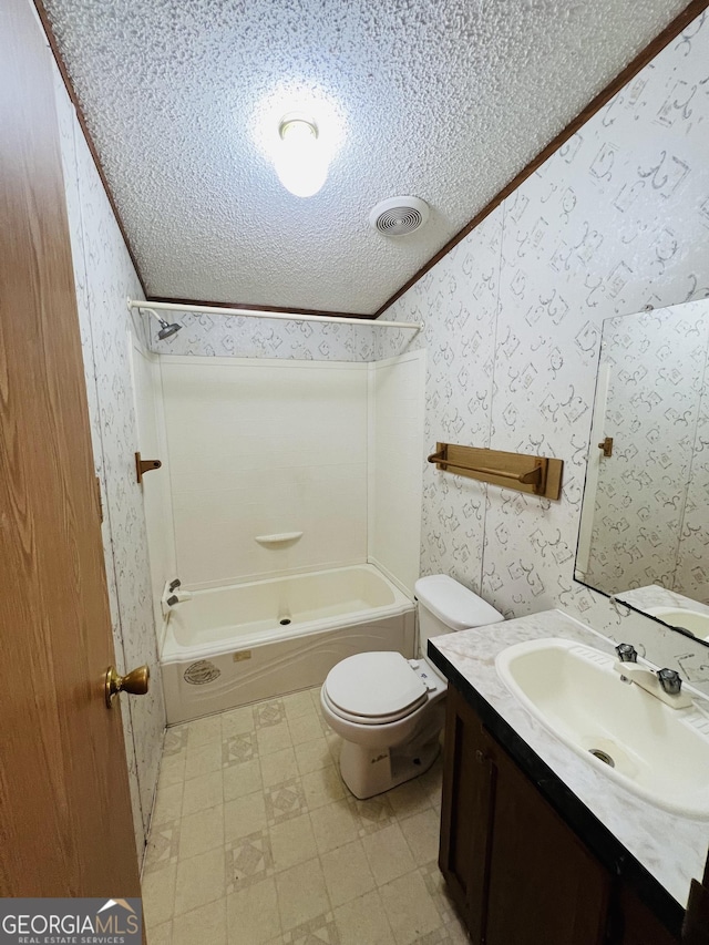 104 Scattered Pines Rd, Hortense, GA 31543 - bathroom featuring a textured ceiling, wallpapered walls, tile patterned floors, bathing tub / shower combination, and toilet