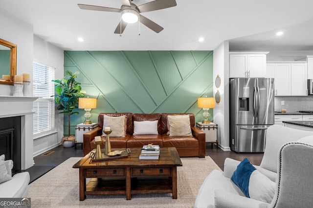 1098 Caruso Dr, Buford, GA 30518 - living room featuring a decorative wall, a ceiling fan, dark wood-style floors, recessed lighting, and a fireplace with flush hearth