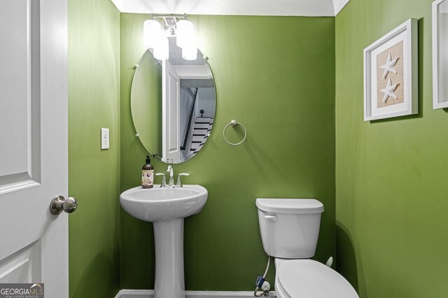 1098 Caruso Dr, Buford, GA 30518 - half bathroom with toilet and a sink