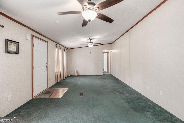 spare room with ornamental molding, a textured ceiling, carpet flooring, and a ceiling fan