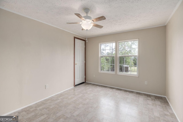 empty room with a ceiling fan, ornamental molding, and a textured ceiling