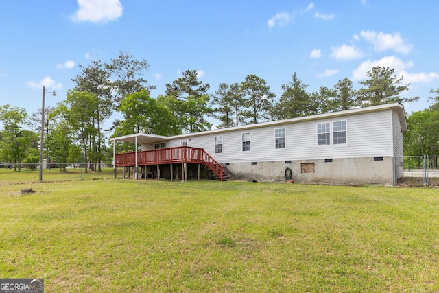 back of house featuring a yard, fence, stairs, crawl space, and a deck