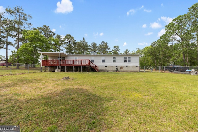 back of house featuring a fenced backyard, a wooden deck, stairs, and a yard