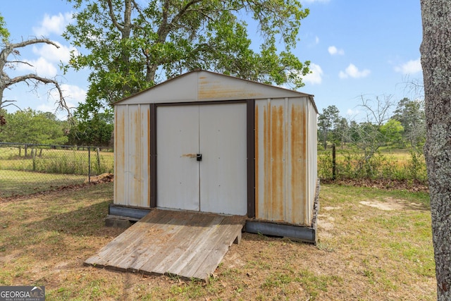 view of shed with fence