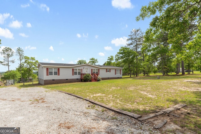 view of front of house with crawl space and a front yard