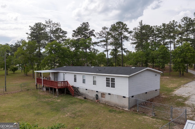 back of property with a yard, fence, stairs, crawl space, and a deck