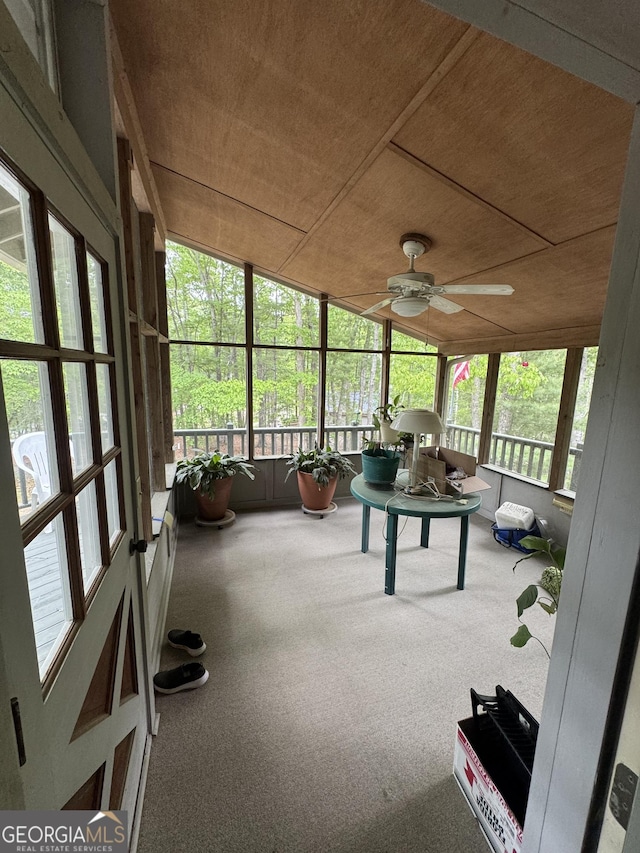 sunroom with a ceiling fan