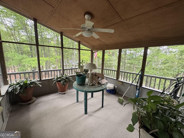 sunroom featuring a ceiling fan